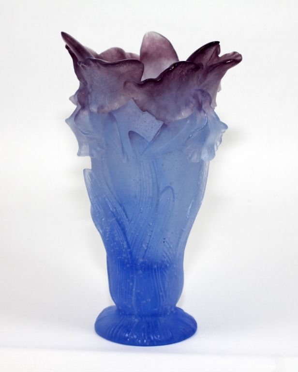 DAUM PATE DE VERRE BLUE ART GLASS FLORAL VASE: A beautiful Daum Pate De Verre French art glass having a translucent blue to lavender tone. Has a figural floral design with raised leaves. 'Daum France' signature to bottom. Measures approx. 8 1/2" h