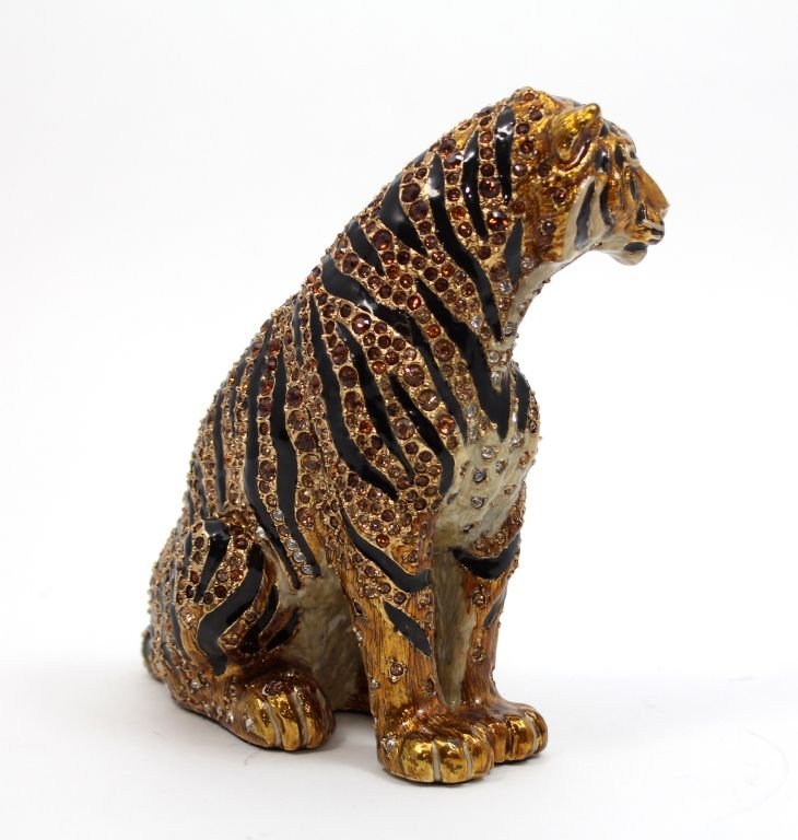 JAY STRONGWATER FIGURAL JEWELED SEATED TIGER FIG: Jay Strongwater enameled and jeweled seated tiger figure. Signed Jay Strongwater to felt bottom and dated 2002. Includes original dust cover bag, box and tag. Measures 6" height. Excellent condition.