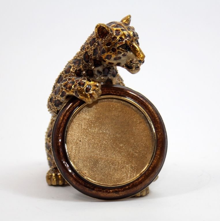 JAY STRONGWATER LEOPARD PICTURE FRAME SIGNED 2002: A very rare Jay Strongwater figural enameled and jeweled leopard figure holding a picture frame. Frame hand signed by Strongwater and dated 2002. Includes original box, pouch and certificate. Excellen