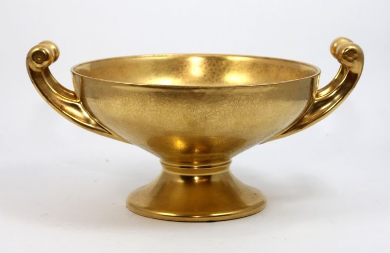HUTSCHENREUTHER GILT PORCELAIN CENTERPIECE BOWL: An early 20th century Hutschenruether German porcelain handled centerpiece bowl. Has a gilt floral design throughout decorated by Pickard. Bottom holds green Hutschenruether marks with gold Pickard sh