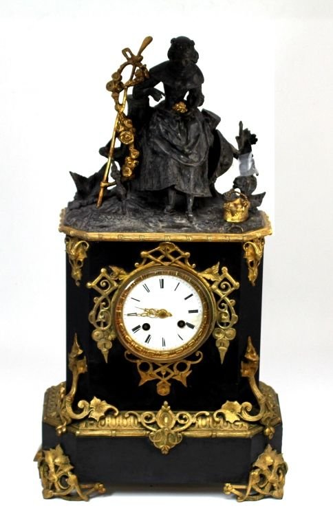 ANTIQUE JAPY FRERES BRONZE MOUNTED MANTLE CLOCK: Antique Japy Freres French bronze mounted black marble mantle clock. Has figural design to depicting a seated woman to top. White enamel face with black Roman numerals at hour marks. Gold scrolled hou