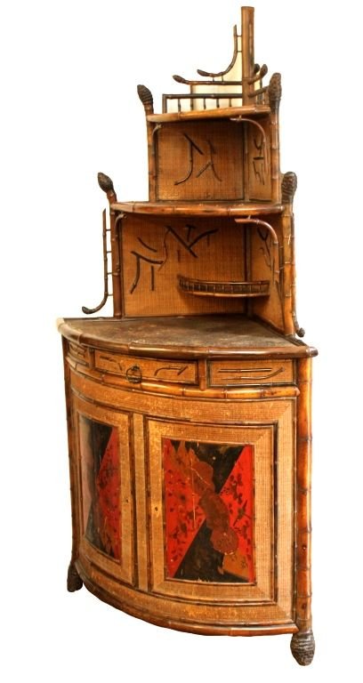 ANTIQUE JAPANESE BAMBOO CORNER CABINET: Antique Japanese genuine bamboo corner cabinet having iron red hand painted folding fan design to front double doors. Top having shelves with applied calligraphy designs. Circa late Edo to Meiji perio