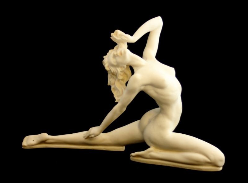 A. SANTINI FAUX IVORY NUDE FEMALE SCULPTURE: A. Santini Italian faux ivory sculpture of a nude female dancer. Measures 9 1/4" height x 14" length. Provenance: From a Loxahatchee, Florida estate.