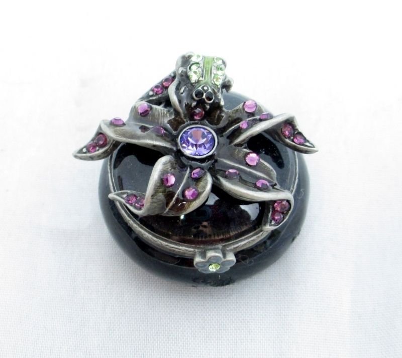 JAY STRONGWATER PORCELAIN JEWELED PILL BOX: Beautiful Floral design measures 1 1/2" Diameter Porcelain and Jeweled Pill Box. Stamped Jay Strongwater on Bottom. Comes with original Presentation box.