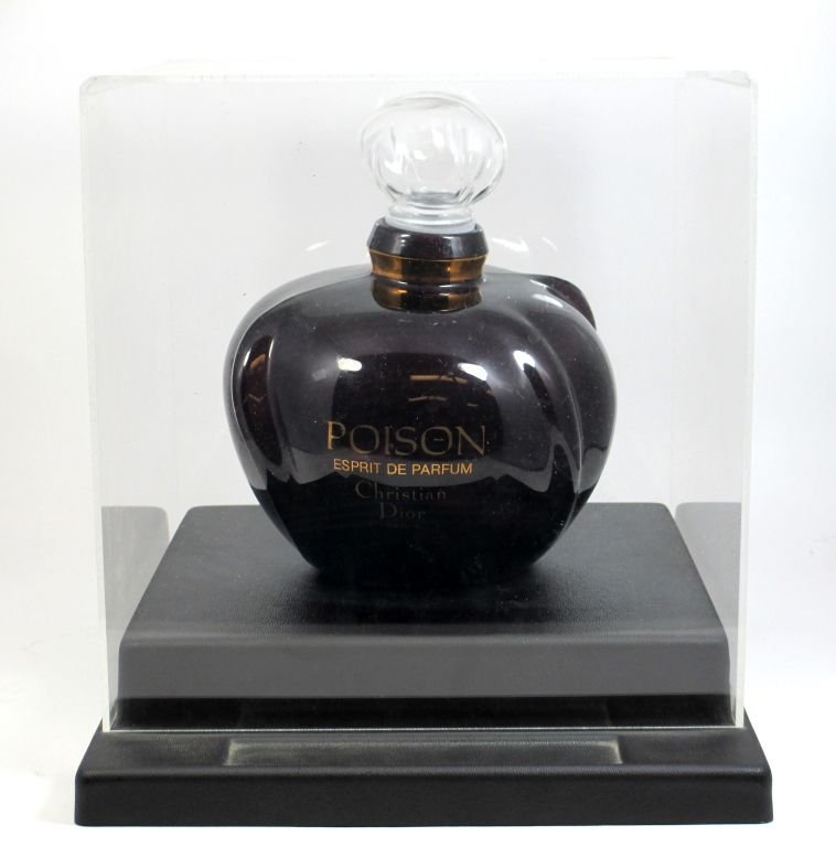 LARGE CHRISTIAN DIOR POISON FACTICE w DISPLAY CASE: A large Christian Dior Paris, France Poison factice perfume display bottle. Includes presentation display box. Bottle having a purple glass design. Bottle measures 9 1/4" height. Overall measurements 