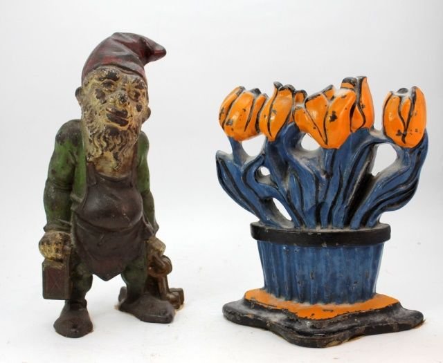 2 ANTIQUE COLD PAINTED CAST IRON DOOR STOPS: A lot of two antique cold painted cast iron figural door stop items including a gnome and flower pot. Second half of the 19th century. Tallest measures 10 1/4" height. Total weight of approx. 5.1 kiog
