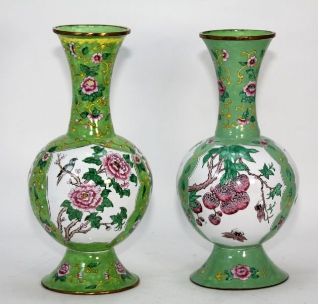 PAIR OF CHINESE REPUBLIC PEKING ENAMEL VASES: A pair of Chinese hand painted Peking enamel fruits and flower vases, each having green ground. One vase depicting peaches, pomegranates and grape clusters with cicada beetles, butterflies and birds. 