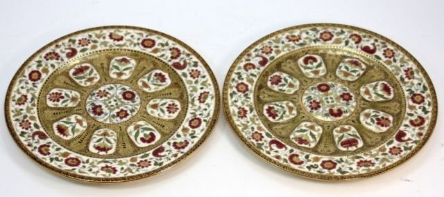 PAIR OF ANTIQUE ZSOLNAY PECS FINE PORCELAIN PLATES: A pair of fine Zsolnay Pâ€šcs Hungarian porcelain hand painted plates having a raised design with flowers and scrolled vines. Gilt accenting throughout. Bottom holds blue under glaze Five Churches