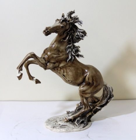 GIUSEPPE ARMANI SIGNED AND DATED HORSE FIGURE: Impressive Horse Figure Standing on Hind Legs. Made in Florence Italy signe dand Dated 1992 17" Tall by 14" Long. Horse has small Chip top left Ear otherwise in perfect shape. Hand Painted Composite F