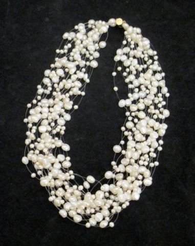 14K YELLOW GOLD CLASP MULTI STRAND PEARL NECKLACE: Ladies multi strand fresh water white pearl necklace having a 14k yellow gold clasp. Marked 14K NF to clasp with infinity symbol maker's mark. Measures approx. 18" length. Total weight of 54.3dwt.