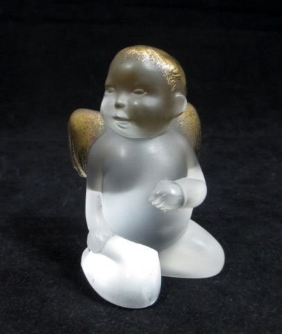 LALIQUE "MALIZIOSO CAPPRICCIOSO CHERUBINO": This cherub figurine was created by Marie-Claude Lalique in 1996 The angel depiction is also known as "MALIZIOSO CAPPRICCIOSO CHERUBINO" The crystal has an opalescent look, a satin-like finish and 24k