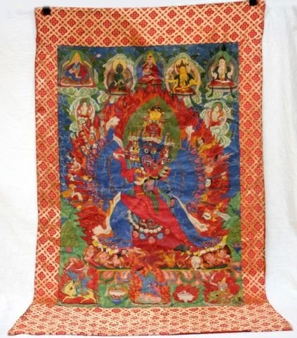 ANTIQUE TIBETAN THANGKA GODS OIL PAINTING ON SILK: Antique Tibetan hand painted Thangka oil painting on silk depicting numerous Buddhist gods. Has silk matting. Circa Great Qing period. Image measures 35 1/4" length x 23 1/2" width. Overall 49" length
