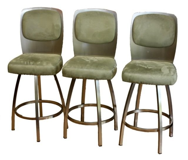 A SET OF 3 TRICA CALVIN SUEDE & METAL BAR STOOLS: A set of three Trica Calvin barstools having a suede and metal design. Chairs retail around $630.00 each. Chairs measure 32 3/4" height x 18" width x 19" depth.