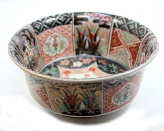 ANTIQUE JAPANESE HAND PAINTED HAND PAINTED BOWL: Antique Japanese hand painted enameled bowl depicting phoenix, cranes and lotus blossoms. Also depicts iron red to black pattern designs. Bottom holds painted lotus blossom mark. Circa late Edo to Mei