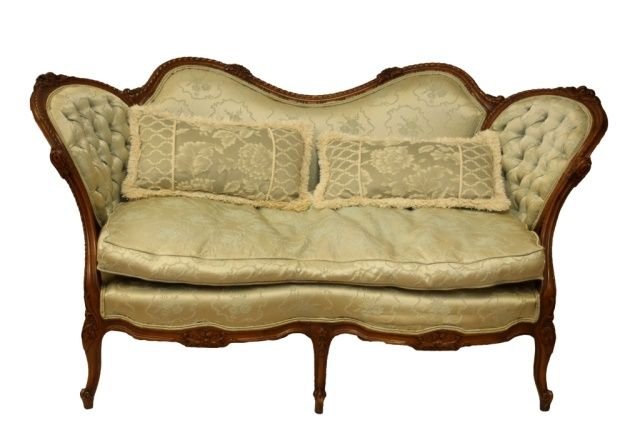 1920's FRENCH SMALL LOUIS XV STYLE MAHOGANY SETTEE: An early 20th century very nice heavily carved Louis XV style floral design mahogany wood frame settee love seat with mint champagne satin upholstery depicting floral bouquets. Tufted front. Circa 192