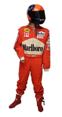 EMMERSON FITTIPALDI RACE WORN SUIT w HELMET, SHOES: Original Emmerson Fittipaldi race worn suit with all patches. Includes original helmet with Hugo Boss logo. Includes his Stand 21 shoes as well.