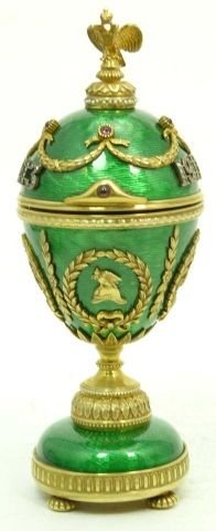 RUSSIAN IMPERIAL GUILLOCHE FOOTED EGG W/ SURPRISE: RUSSIAN IMPERIAL SILVER & GREEN GUILLOCHE FOOTED EGG W/ SURPRISE. GOLD GARLANDS. HOLDS THE IMPRESSED WORK MASTERS& SILVER PURITY MARKS. MEASURES 5.5' TALL. TOTAL WEIGHT 7.25 OZT
