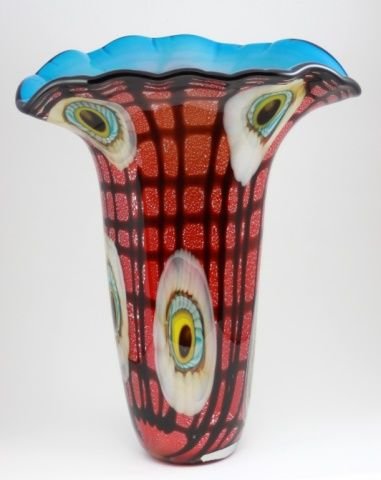 LARGE MURANO ITALIAN GLASS PEACOCK FEATHER VASE: A large contemporary Italian hand blown glass vase having a peacock feather design with sporadic millefiore. Black web over red ground throughout. Ann Primrose collection with label to bottom. Measure
