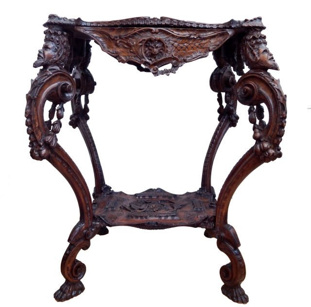 IMPRESSIVE ITALIAN 1860's CARVED OAK SATYR TABLE: Impressive Italian antique hand carved oak table having a striking scrolled design throughout with figural Satyr faces. Stretcher having raised scrolled design. Has drawer to front. Circa 1860's. Meas