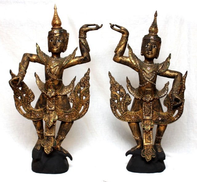 A PAIR OF LAOS CARVED JEWELED GILT WOOD FIGURES: A pair of large and antique jeweled gilt wooden figures depicting standing Buddha. Circa 1930's. Crafted in Laos or Cambodia. Measures 35" height x 17" width. Total weight of approx. 9 kilograms.