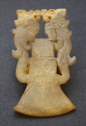 CHINESE JADE HAND CARVED BELL & FOO LIONS PLAQUE: Hand carved Chinese jade figure depicting two foo lions facing each other over a bell. Hand etched designs throughout. 19th/20th century. Measures 3 1/4" height (8.2cm).