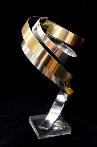 DAN MURPHY MODERN METAL & LUCITE SCULPTURE: Dan Murphy (AMERICAN, worked 1976 - ) modern sculpture depicting gold and silver tone anodized aluminum in abstract form mounted on a square Lucite base. Signed 'DAN MURPHY C1995'. Measures approx. 26