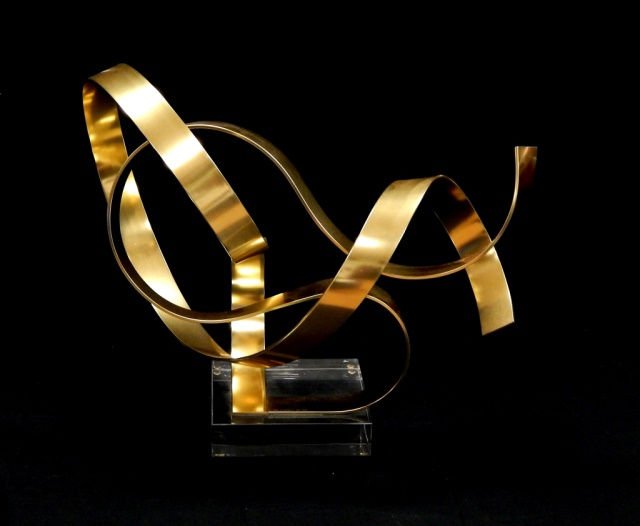 DAN MURPHY MODERN METAL & LUCITE SCULPTURE: Dan Murphy (AMERICAN, worked 1976 - ) modern sculpture depicting gold tone anodized aluminum in abstract form mounted on a square Lucite base. Signed 'DAN MURPHY C1981'. Measures approx. 16" height x