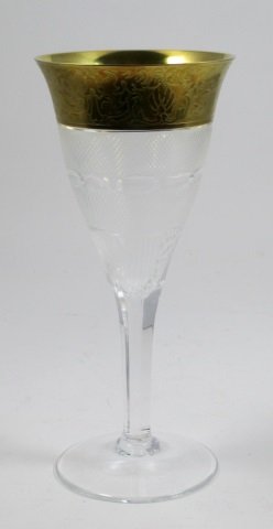MOSER CRYSTAL 'SPLENDID' WATER GOBLET STEM GLASS: A Moser Czechoslovakian crystal water goblet in the Splendid pattern. Scrolled gilt design to rim. Bottom holds Moser acid mark in lozenge. Measures 8 5/8" height. Total weight of 240 grams.