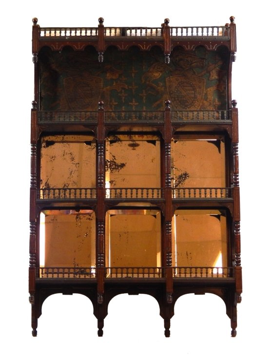 ANTIQUE ENGLISH WOODEN 4 SHELF WALL RACK: Antique English carved mahogany four shelf wall rack having set green tapestry depicting shield crests. 6 panels of square beveled glass mirrors set. 19th century. Measures approx. 38" height x 24" wi