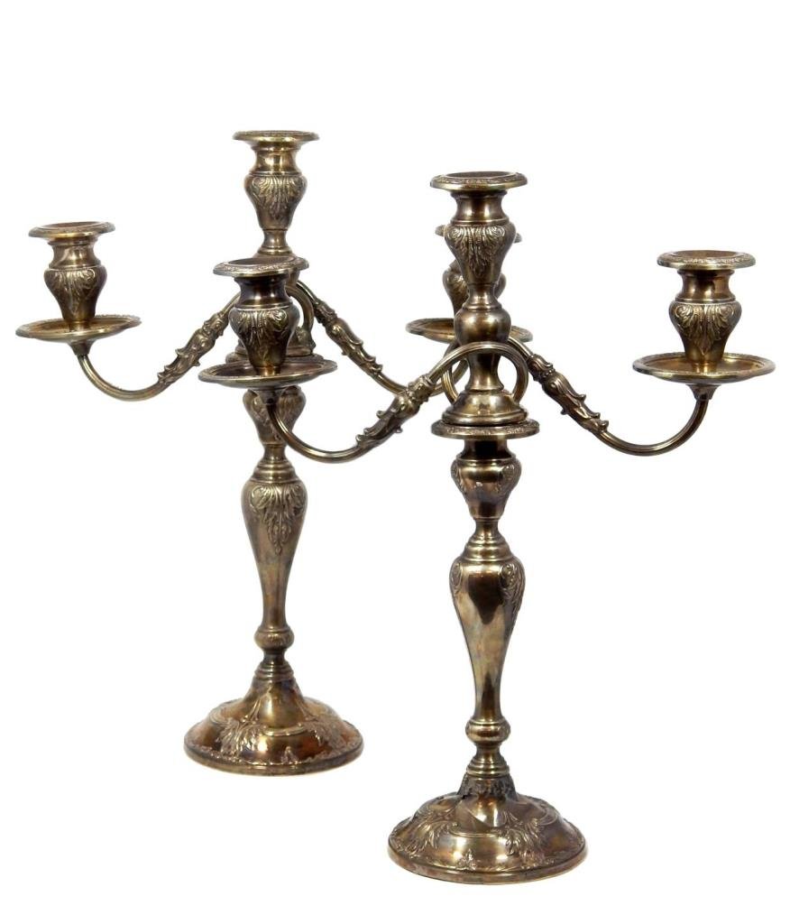 PAIR OF FRANK WHTIING STERLING SILVER CANDELABRA: A pair of Frank Whiting American sterling silver weighted three arm candelabra having a raised scroll design throughout. Top portion can be removed to use as candlesticks. Circa late 19th to early 20t