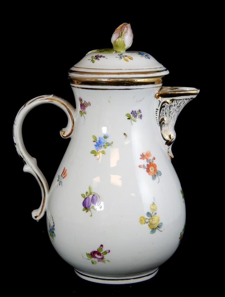 ANTIQUE CARL THIEME GERMAN PORCELAIN FLORAL TEAPOT: A late 19th century Carl Thieme at Potschappel-Dresden German porcelain hand painted floral teapot having gilt accenting. Figural floral finial. Measures 9" height. Total weight approx. 813 grams.