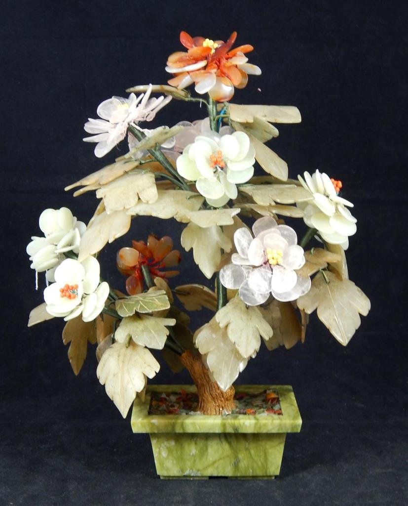 CHINESE JADE & STONE FLOWERING BONZAI TREE: Vintage Chinese flowering bonzai tree crafted with jade, rose quartz, and carnelian agate set in green hard stone planter base. Has red coral and egg yolk yellow tone enamel beads. Measures approx. 12