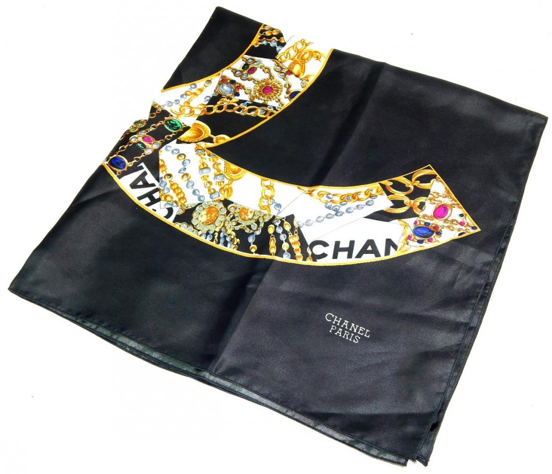 CHANEL FRANCE BLACK SILK MONOGRAM SCARF: Chanel French black silk handkerchief scarf having a monogram design. Measures approx. 35" x 34".