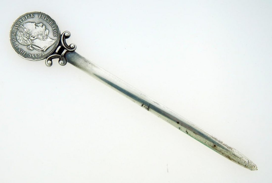 1883 AUSTRIAN 1 FLORIN SILVER COIN LETTER OPENER: 800 Austrian silver letter opener crafted with 1883 1 Florin coin. Holds Hoopoe bird mark with 800 purity mark and Vienna mark. Holds FC workmaster marks. Crafted circa the first half of the 20th cent