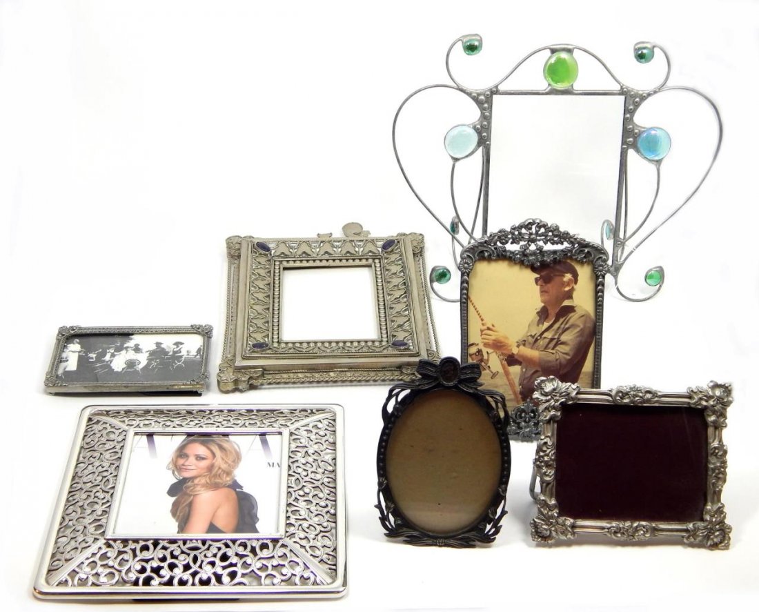 (7) DECORATIVE ORNATE PICTURE FRAMES: (7) DECORATIVE ORNATE PICTURE FRAMES . LARGEST MEASURES 10" TALL AND THE SMALLEST MEASURES 4.5" TALL.
