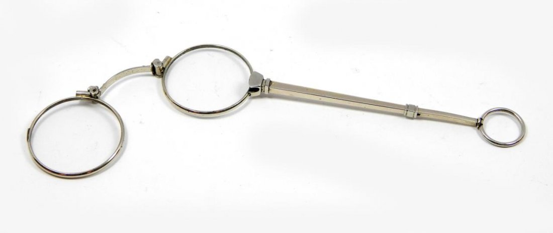 VINTAGE SILVERPLATE LORGNETTE GLASSES: A pair vintage silver plate lorgnette glasses. Has folding mechanism. Measres approx. 6 1/8" length. Total weight approx. 21.4 grams.