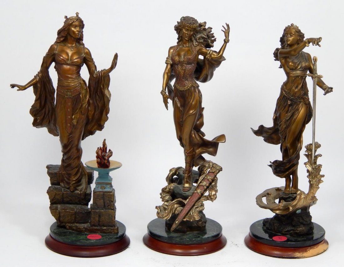 SET OF 3 EMILY KAUFMAN KING ARTHUR BRONZE FIGURES: A set of three Franklin Mint King Arthur Camelot bronze female sculptures by Emily Kaufman including Queen Guinevere, The Lady of the Lake and Morgan Le Fey. Each mounted on dark green marble and wood