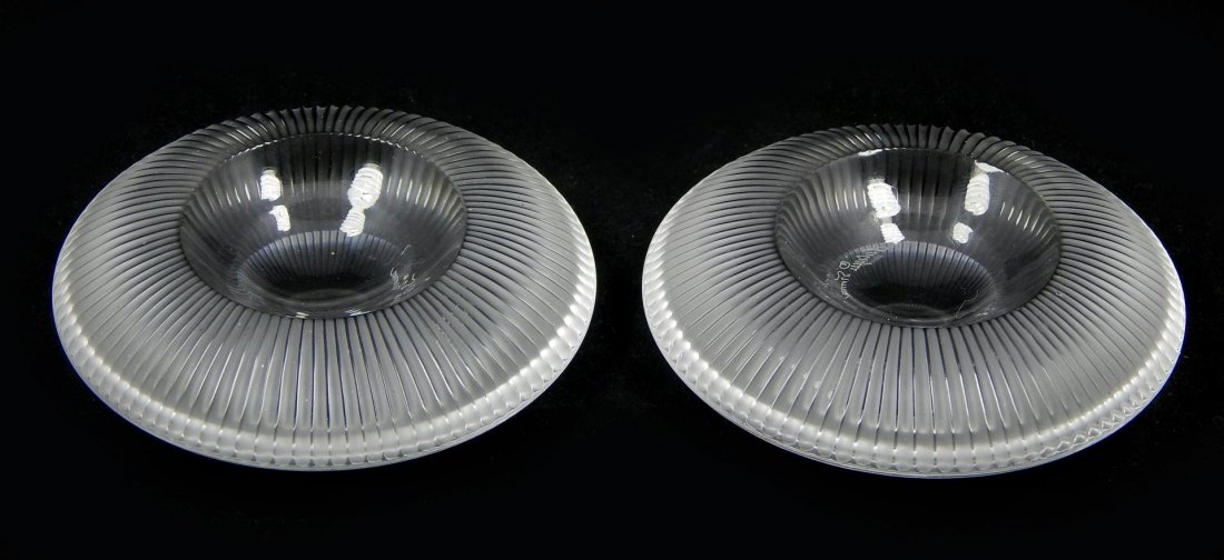 (2) LALIQUE FRANCE CRYSTAL EGG HOLDERS: (2) LALIQUE FRANCE CRYSTAL EGG HOLDERS . EACH MEASURES 3/4" X 2 3/4". TOTAL WEIGHT: 740g. SIGNED ON BOTTOM OF THE PIECE & COMES WITH THE ORIGINAL BOXES.