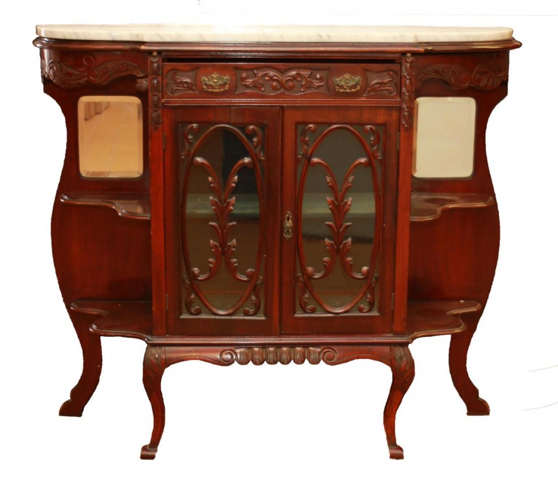 EARLY 20th CENTURY ENGLISH MAHOGANY BUFFET CONSOLE: Early 20th century mahogany buffet console having white marble top. Single drawer to front with glass and reticulated wood double doors. Two shelves flank each side with mirrored backs. Old 'Hoult's L