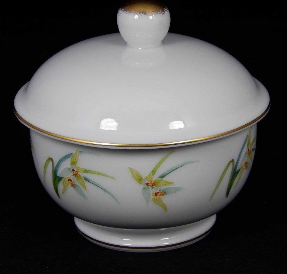 LALIQUE PORCELAIN ORCHIDEES COVERED SUGAR: Lalique French Limoges porcelain 'Orchidees' covered sugar ith yellow stylized band design. Includes box. Measures approx. 4" height. Total weight approx. 311 grams.