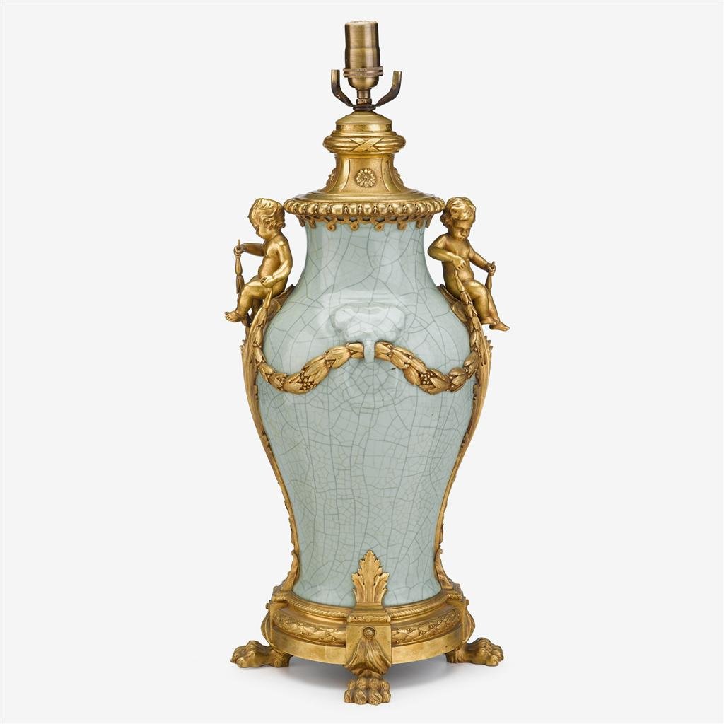 French ormolu mounted Chinese celadon vase: French ormolu mounted Chinese celadon vase 19th century, the porcelain possibly 18th century Baluster form, the celadon ge-type jar with integral mask and ring handles issuing ormolu swags held by sea