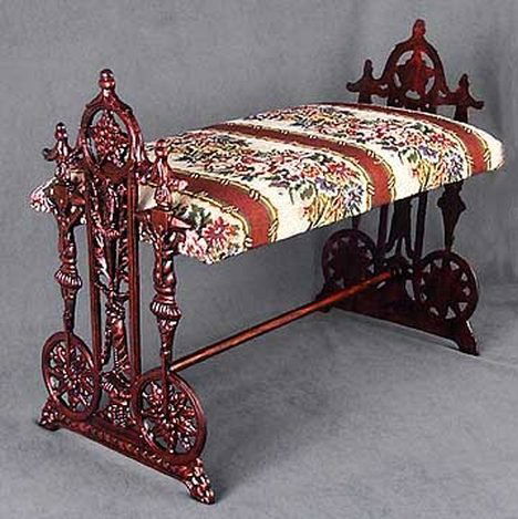 GARDEN GATE CAST IRON FOOT STOOL: GARDEN GATE CAST IRON FOOT STOOL - ANTIQUE COPPER FINISH - APPX 15"H X 19"W X 10.5"D - FABRIC MAY VARY - CAN BE EASILY RECOVERED