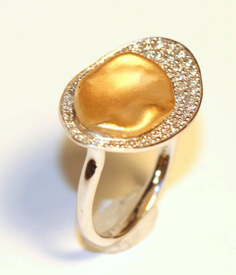 Sonia Bitton 14K White & Yellow Gold Ring with Pave Set: Sonia Bitton ring features an oval 14k yellow gold thumbprint wedge set on a white gold band and surrounded by oval with 52 pave set diamonds. Color: H-I Clarity: SI-2 to I-1 Cut: Good Size: 8 TW and