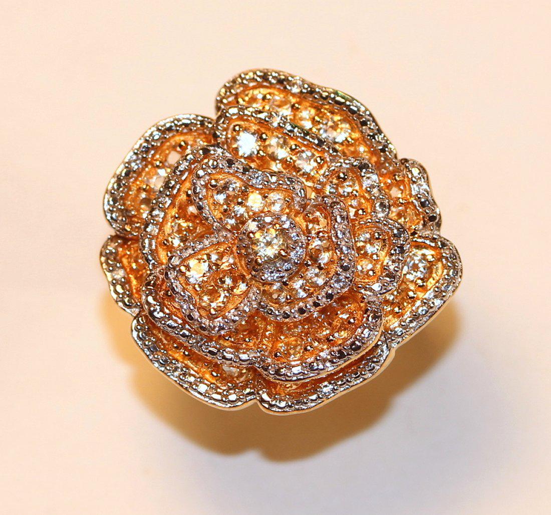 Floral Motif Yellow Sapphire & Diamond 18K Ring: Floral motif 18k yellow gold one piece cast ring set with yellow sapphires and diamonds throughout. Color: H-I Clarity: SI-2 to I-1 Cut: Fair TW of Colored Stones; 1.98ct TW of Diamonds: 0.10ct TW