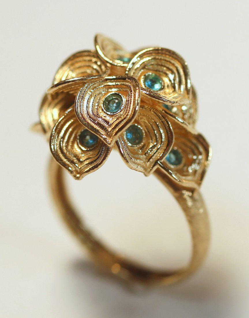 Adi Paz 14K Yellow Gold Calla Lilly Ring with Apatite: Adi Paz 14k yellow gold ring features twelve calla lily designs set each set with an Apatite gemstone. TW of Colored Stones: 0.36ct TW of Ring: 4.00gm Size: 6 TW and sizes are Approximate. See accompa