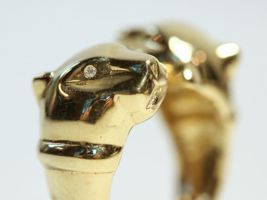 14K Double Headed Panther Ring with Diamond Eyes: 14K cast double headed, bypass style panther ring with diamond eyes. TW of Diamonds: 0.03ct TW of Ring: 7.62gm Size: 8 TW and sizes are Approximate. See accompanying appraisal copy for in-depth descri