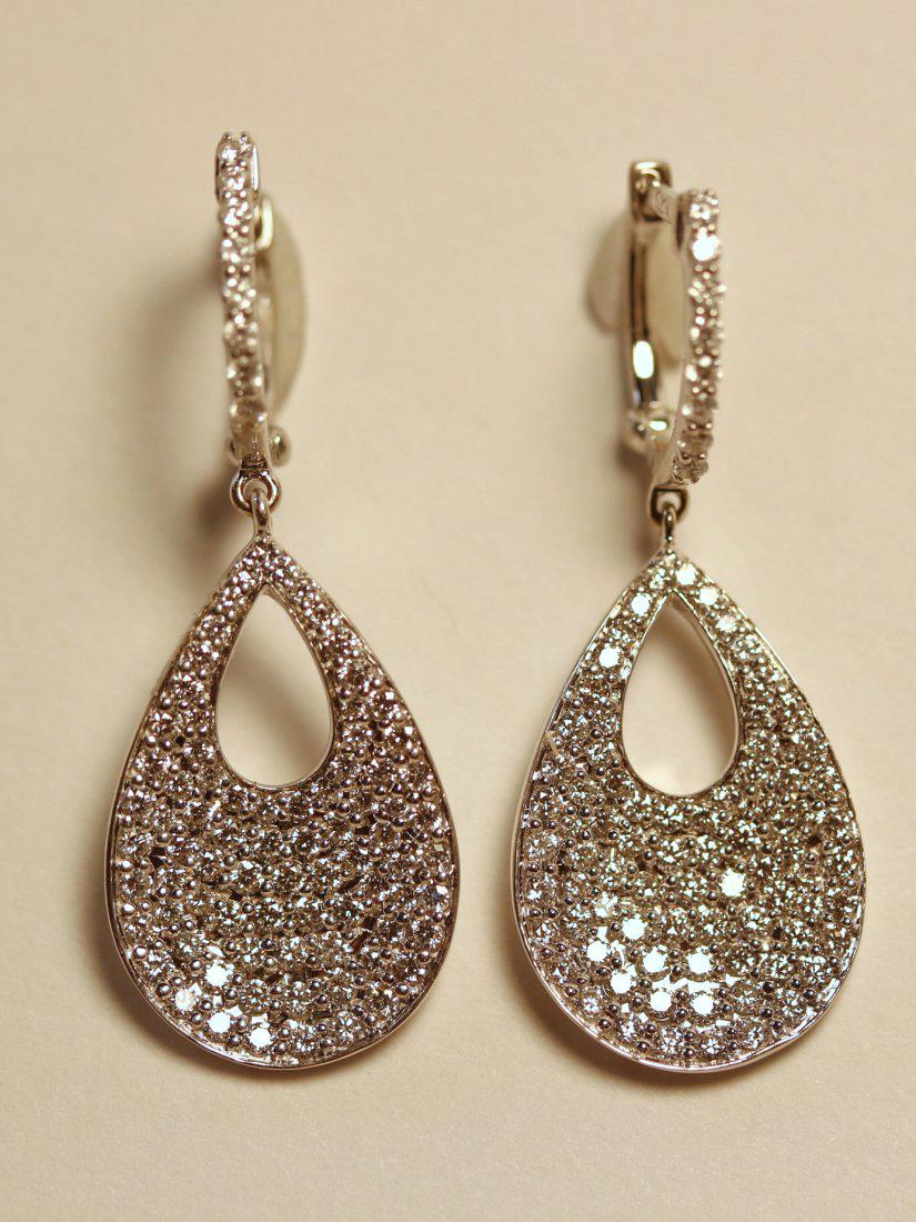 Roberto Coin 18K White Gold Diamond Drop Earrings: 18k white gold drop earrings with lever backs and pierced bar hoops with eight diamonds across top. The tear shaped drop features seventy-eight pave set, round brilliant cut diamonds. A total of One h