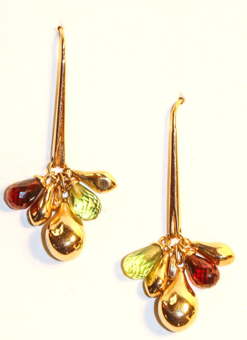 Laura Gibson 18K Yellow Gold Earrings: Laura Gibson 18k yellow gold with elongated ear wire at the end of the drop dangles a briolette peridot, a garnet gemstone and three yellow gold teardrop charms. TW of Earrings: 9.42gm TW and sizes ar