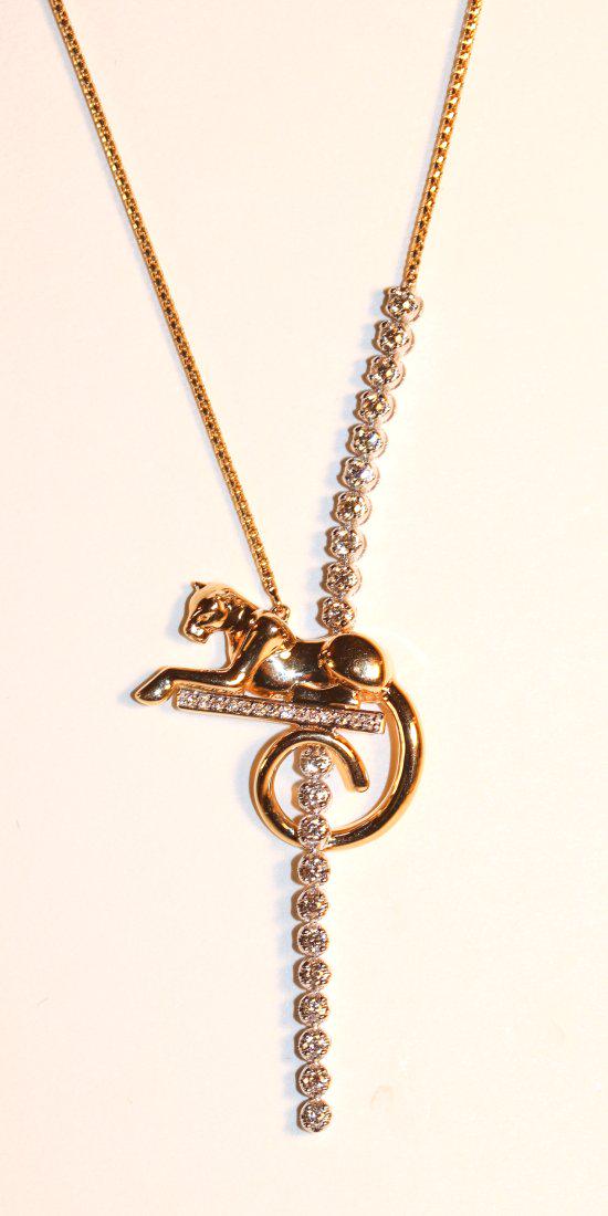 Panther 14K Yellow Gold & Diamond Necklace: 14k yellow gold box link chain attached to a profile of a panther extended out on a white gold bar with fourteen bead-set diamonds. Set vertically, above and through the tail is an 80mm long vertical 