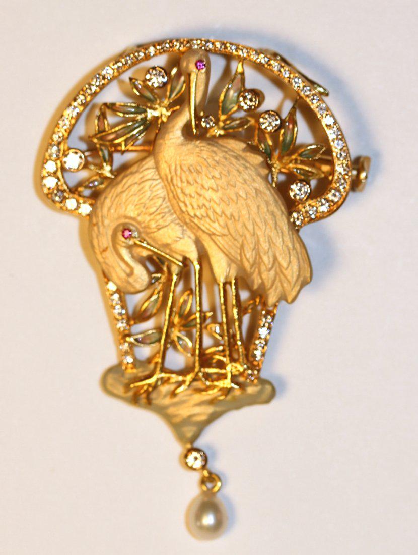 Masriera 22K Yellow Gold Art Nouveau Style Heron Brooch: Masriera 22k yellow gold brooch or pendant with double heron design. Satin finish, herons have ruby eyes. Accents include a leaf motif Pique-a-Jour and bezel set round brilliant cut diamonds and a sin